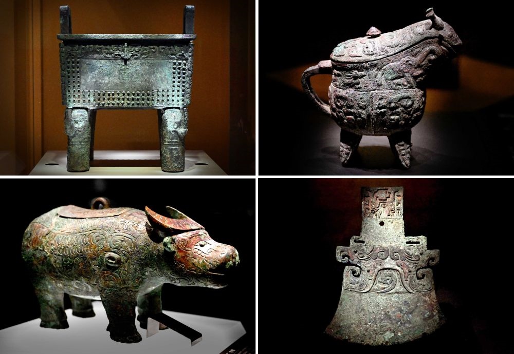 這是殷墟博物館新館內(nèi)展出的“司母辛”銅鼎（左上）、“亞長”銅觥（右上）、“亞長”牛尊（左下）、“亞長”銅鉞（拼版照片，2月23日攝）。